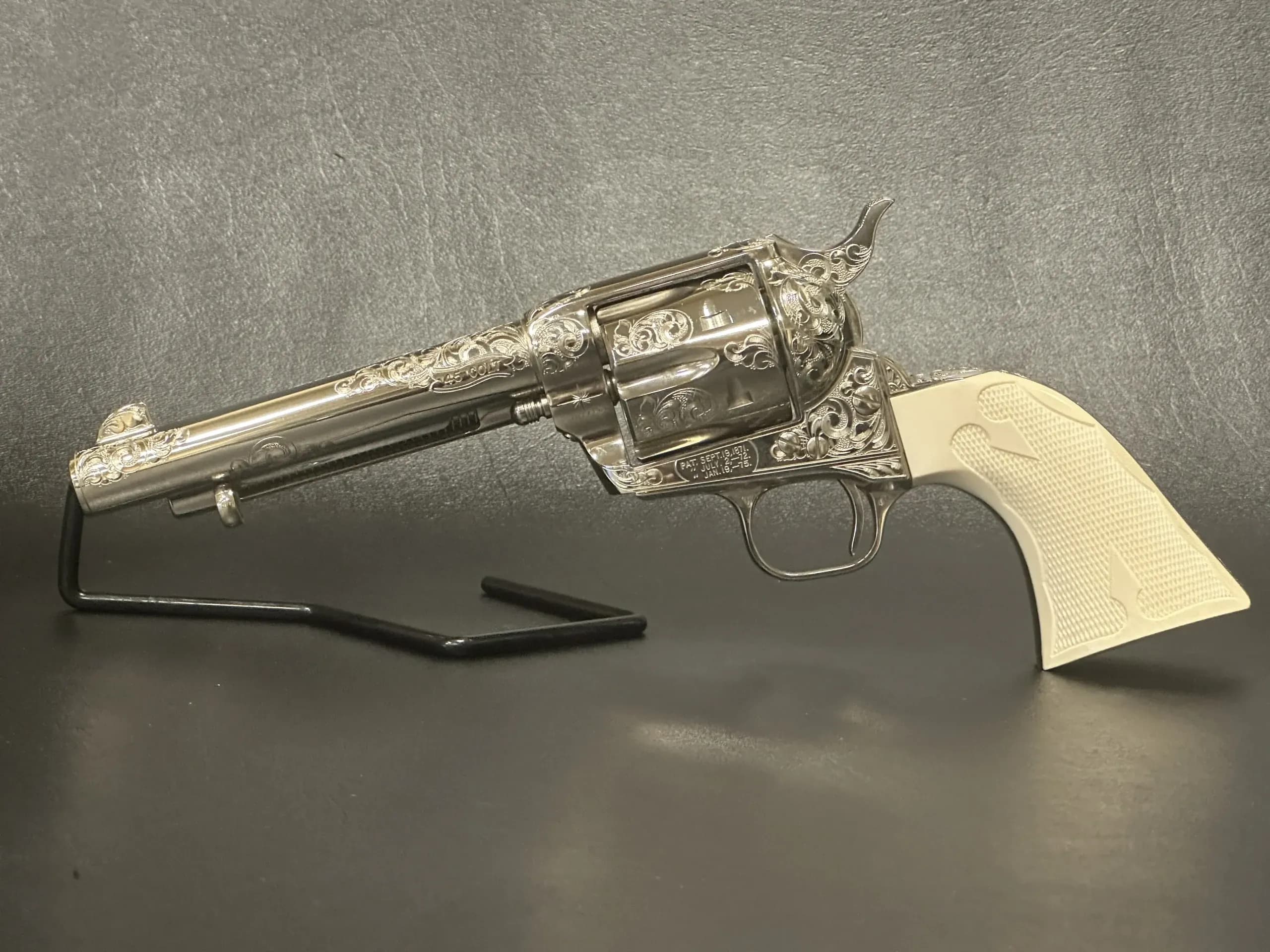 Colt 3rd Gen Single Action Army Engraved Nickel Full View 2 firearm shown in detail view