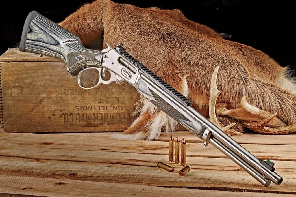 Marlin 1895 Sbl Right Side View with Ammunition and Deer Hide firearm shown in detail view