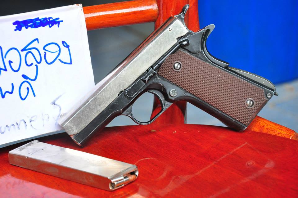 Colt M1911a1 Right Side View with Magazine pistol shown in detail view