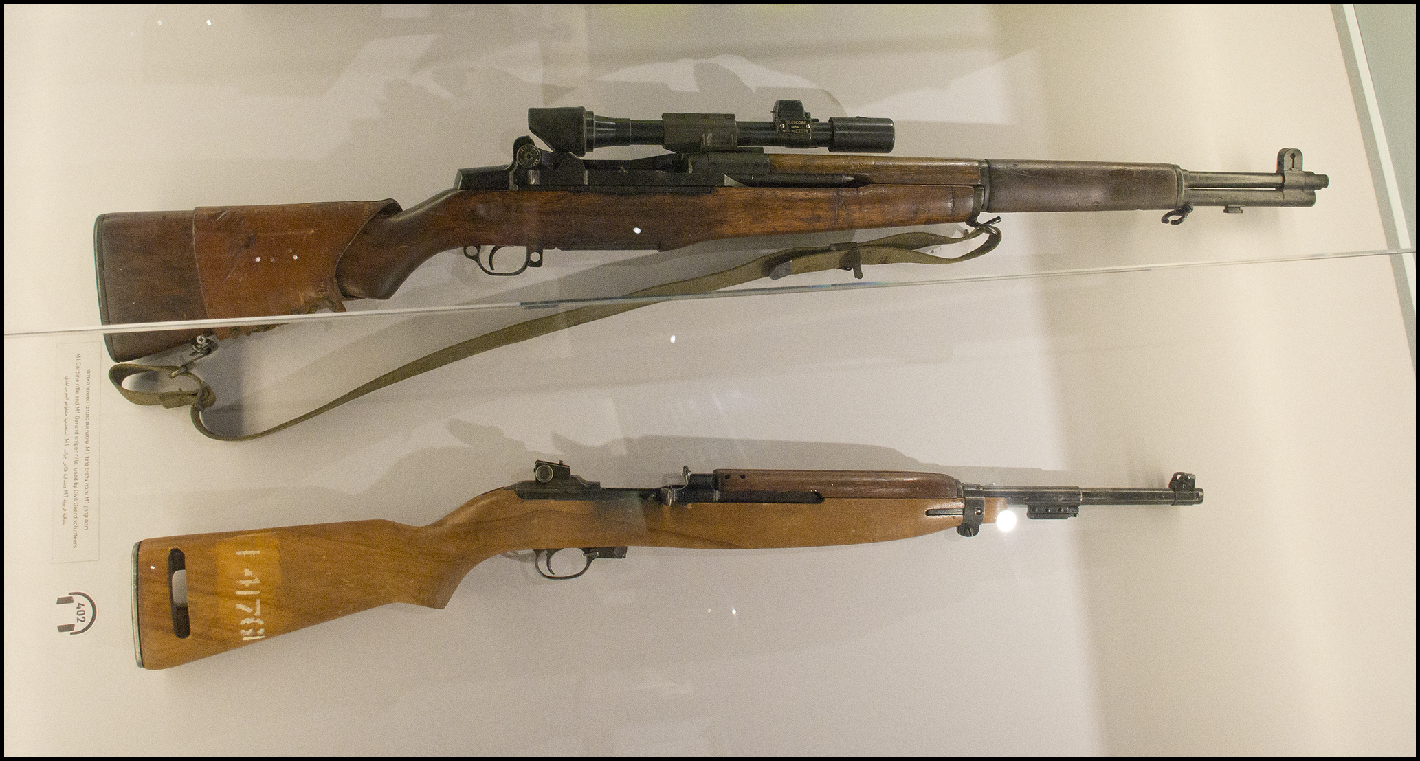 Springfield Armory M1 Garand M1 Carbine Museum Display Two Rifles Right Side View shown in detail view