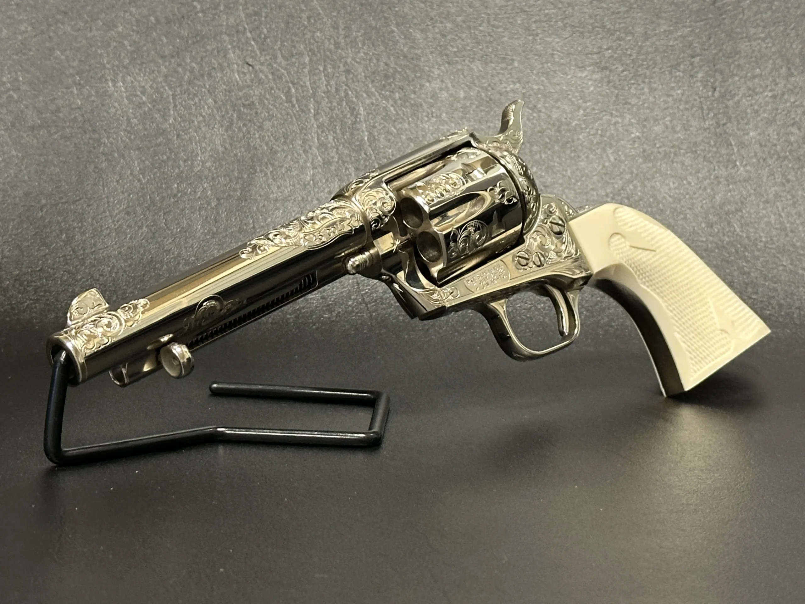 Colt 3rd Gen Single Action Army Engraved Nickel firearm shown in close-up detail